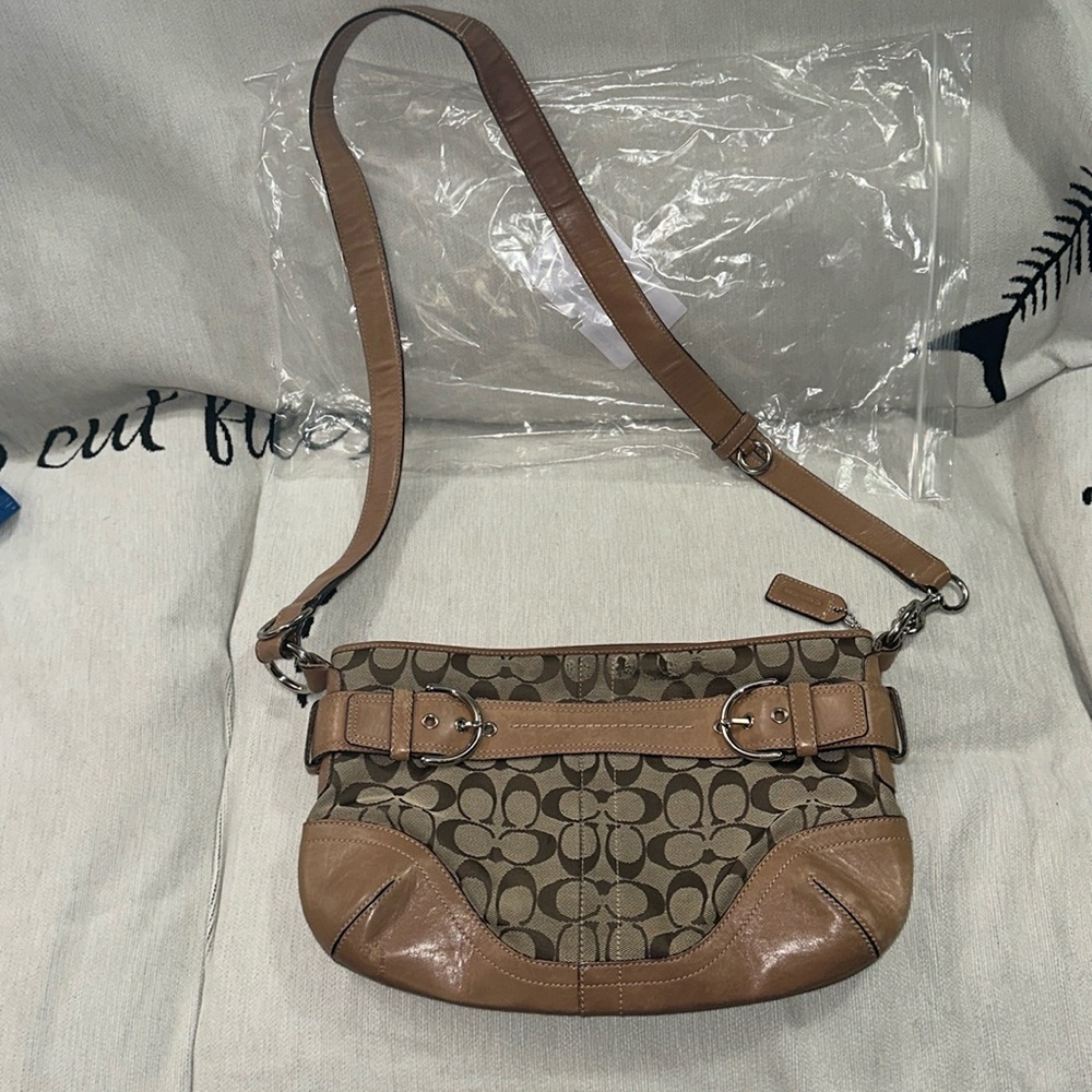 Coach signature crossbody tan and brown with buckle details damaged